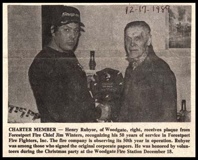 henry rubyor receives fire fighter plaque for 50 years service december 18 1989